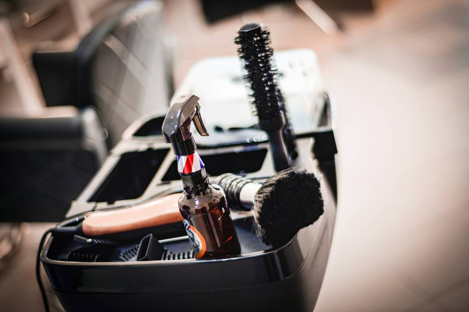 A jar of premium beard balm on a wooden surface