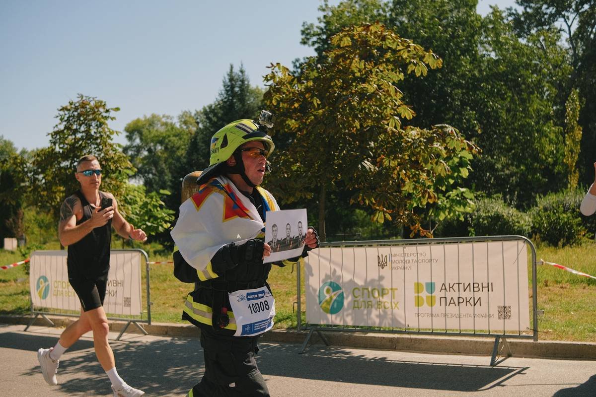 Runner passes official at outdoor event