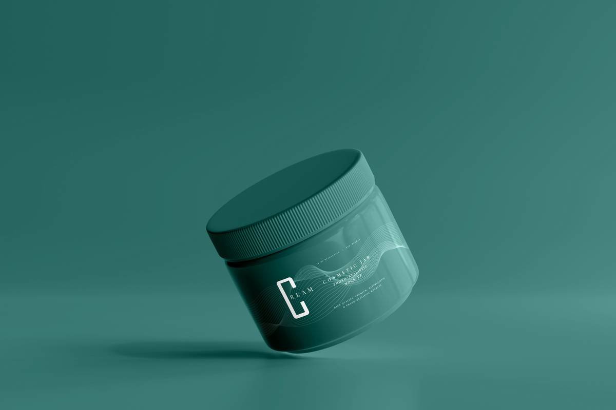 Man applying beard shaping cream with fingers for precise control